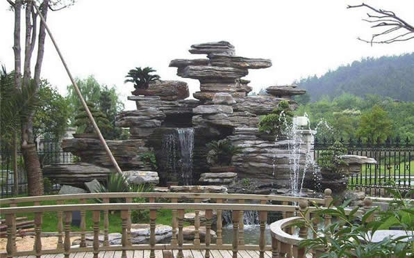 喷泉水池千层石假山制作”